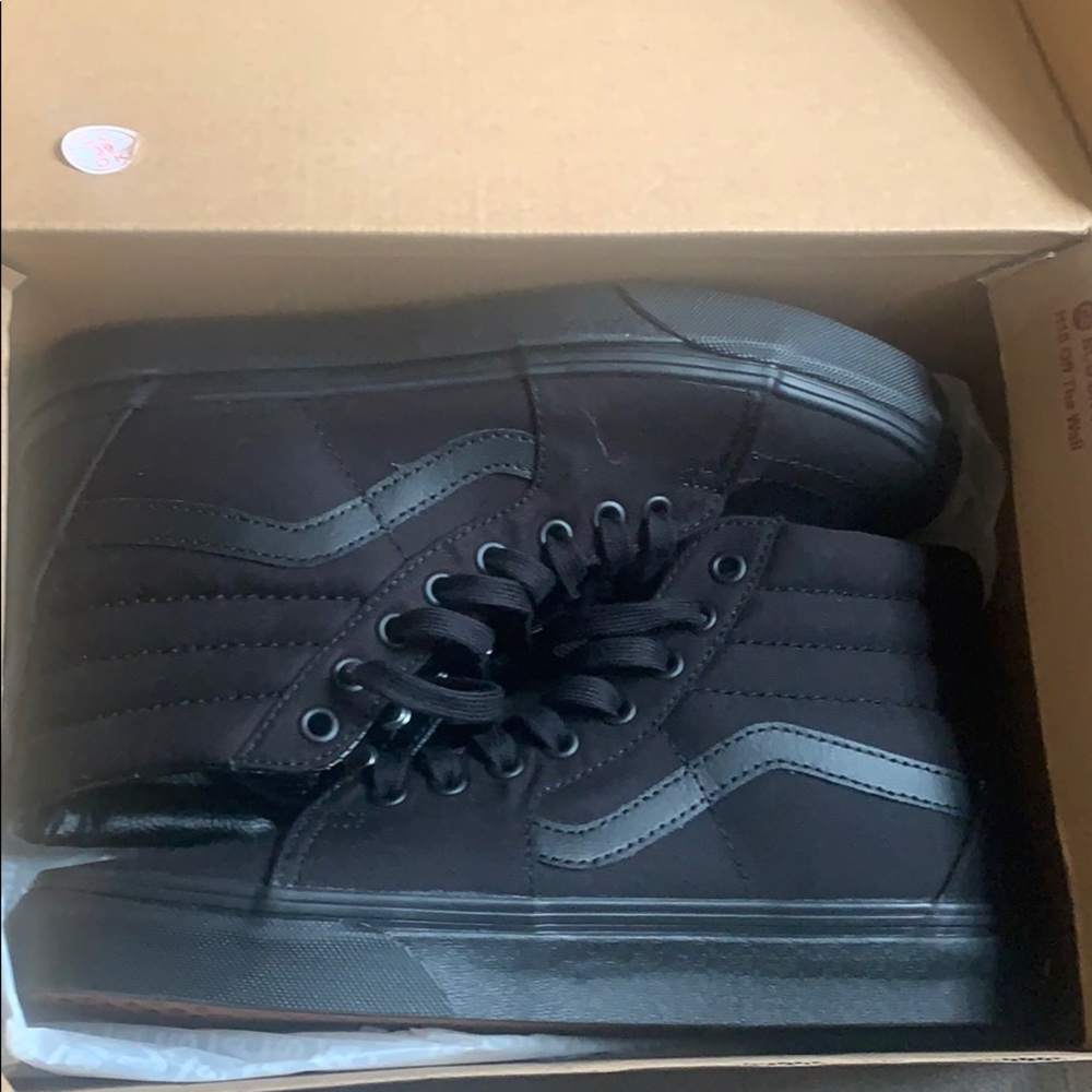 Vans black in black high top sneakers